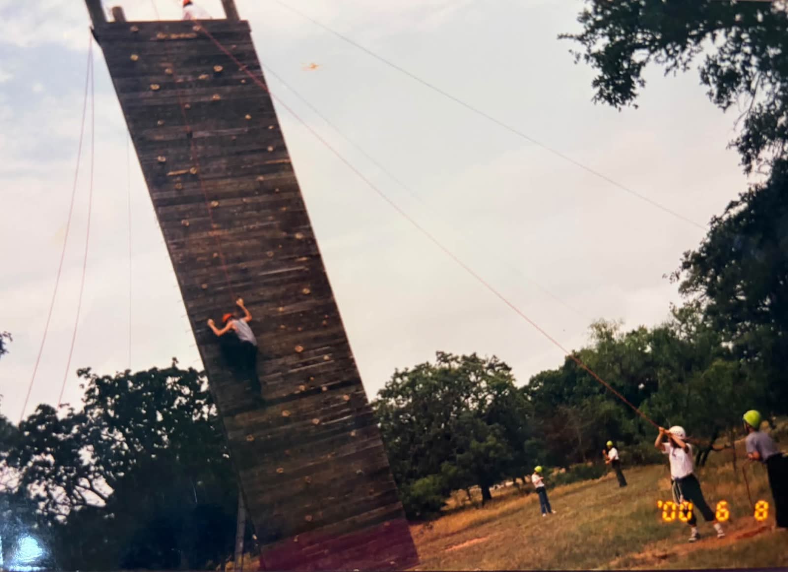 A Troop 205 scout climbing the C.O.P.E. tower at camp